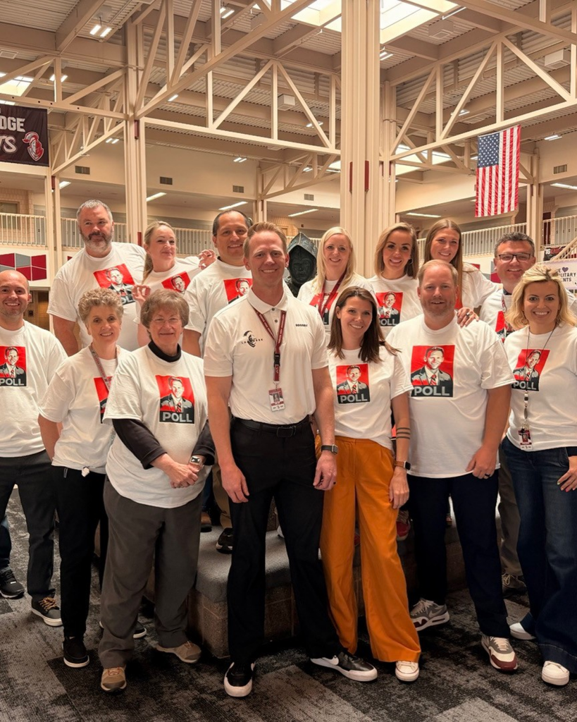 A group of people wearing matching shirts.