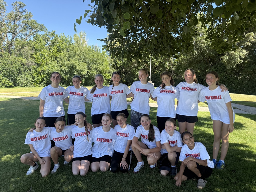 image of girls posing, some standing, some kneeling wearing shirts that say kaysville