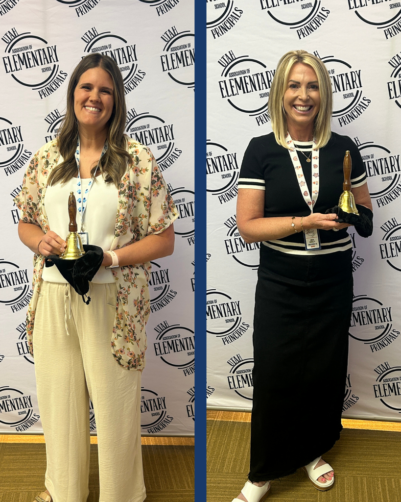 Two principals holding golden bells standing in front of a sign that reads Utah Association of Elementary School Principals.