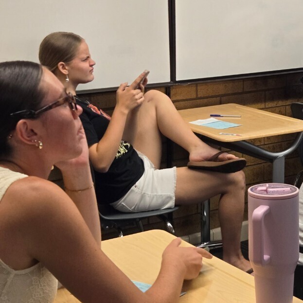students in class playing an online quiz game about driving