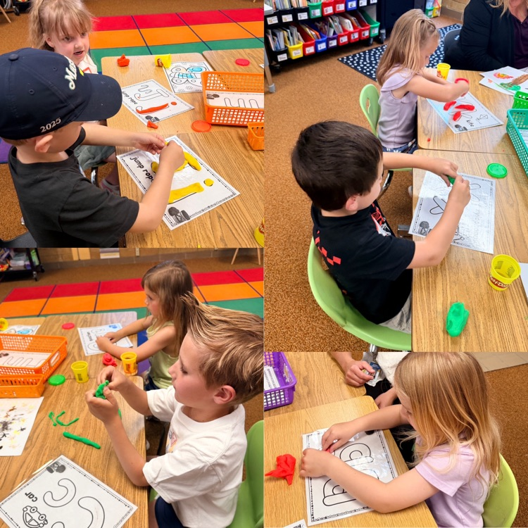 students using play doh to create letters, while practicing identifying letter names and their sounds
