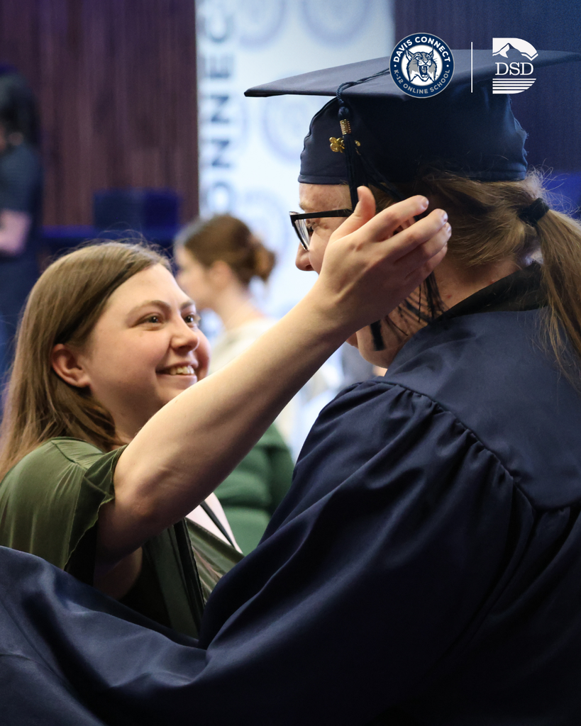 A Davis Connect graduate hugging a relative.