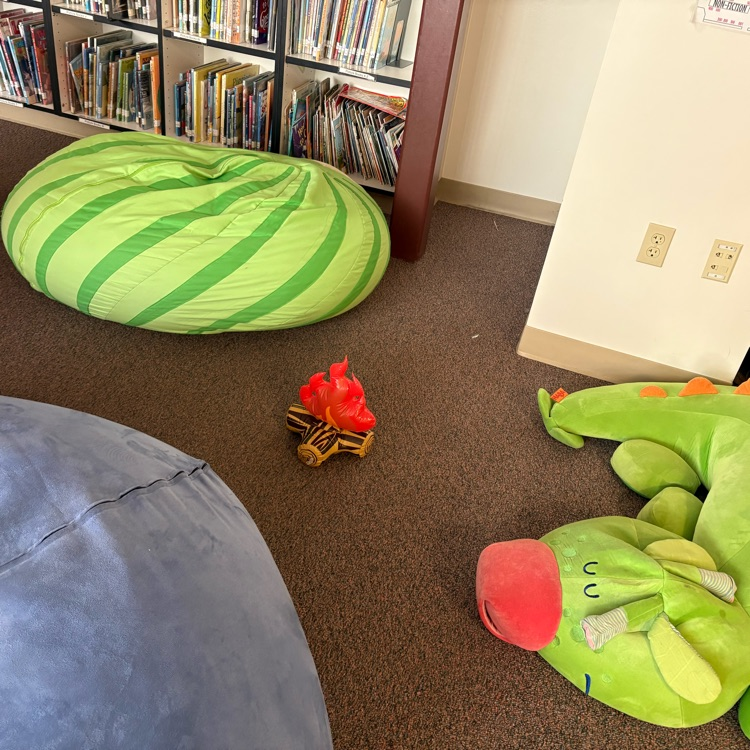 Fake fire surrounded by beanbags