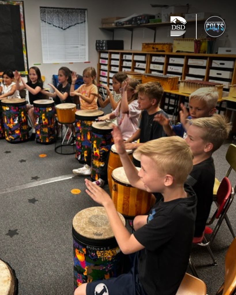 Students playing the drums.