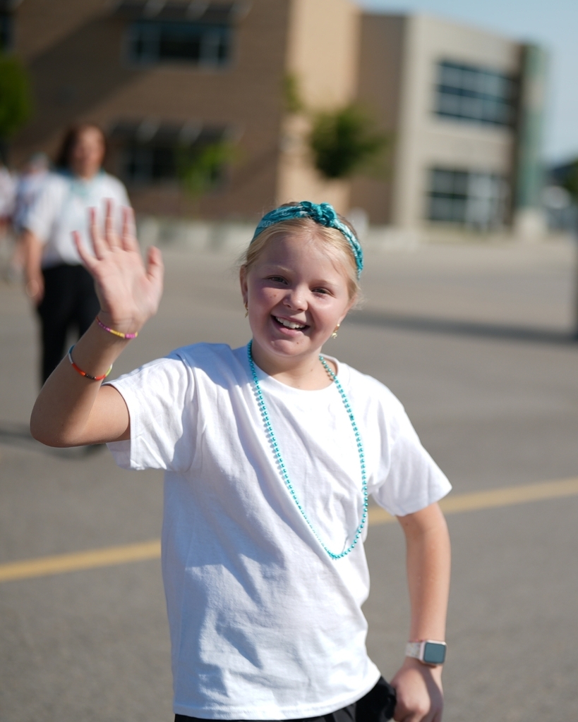 A student waving.