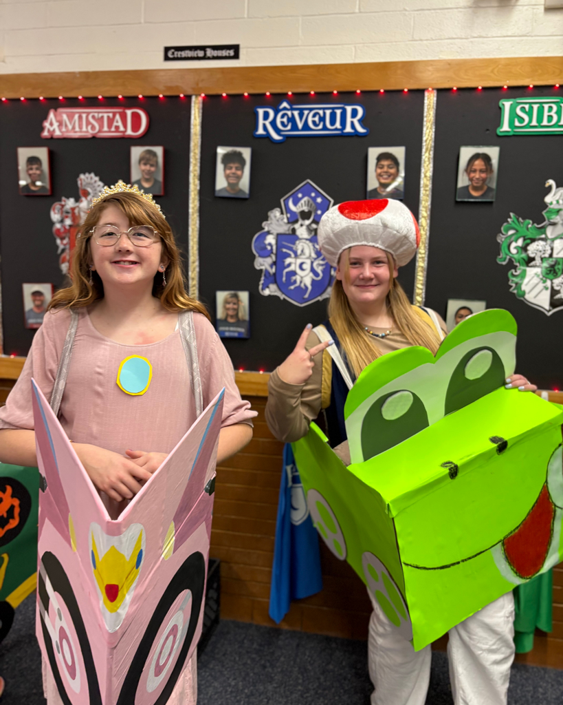 Students dressed up wearing colored cars.