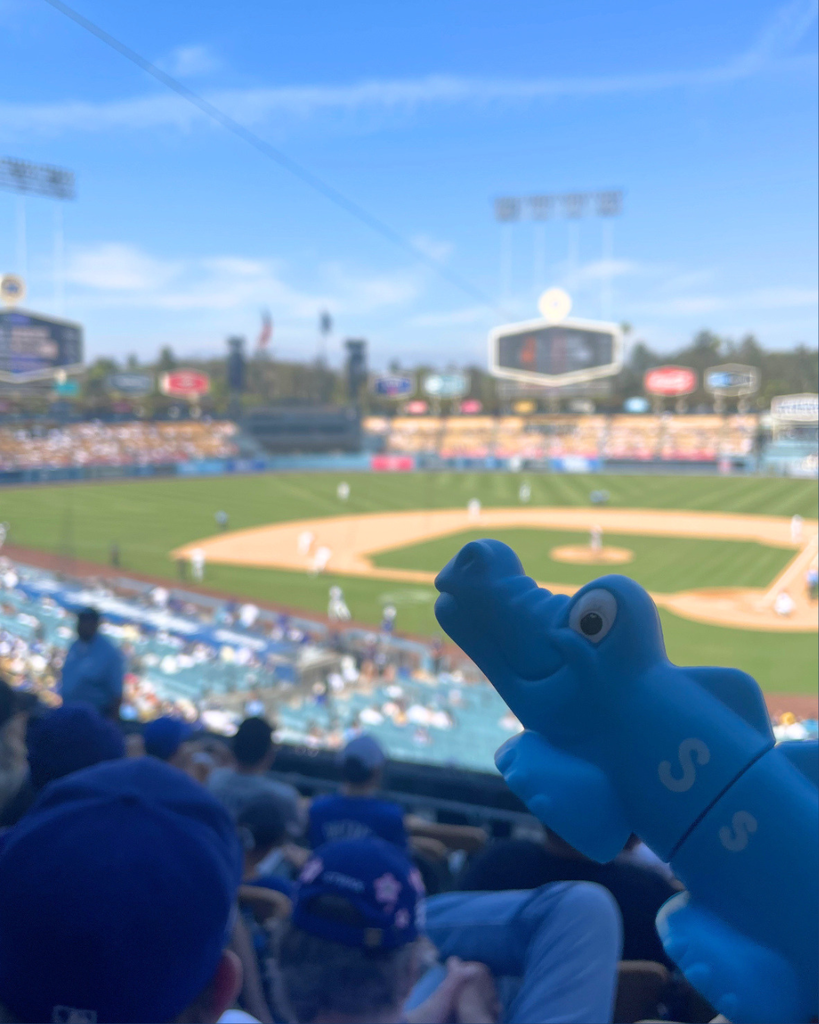 A crocodile at a baseball game.