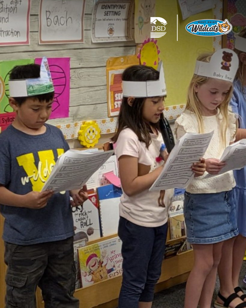 Students reading off of a paper. 