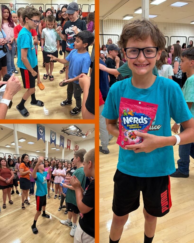 Students play rock paper scissors until a final winner and the winner stands with a bag of candy