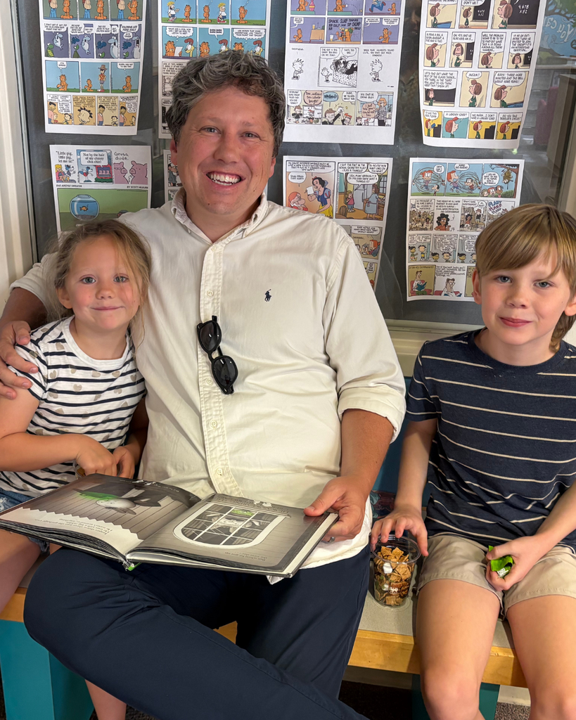 Parents and students reading together.