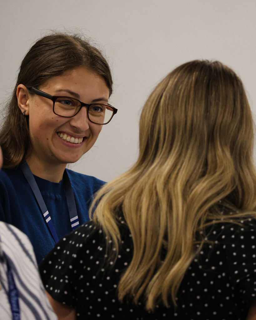 Someone smiling during a conversation.