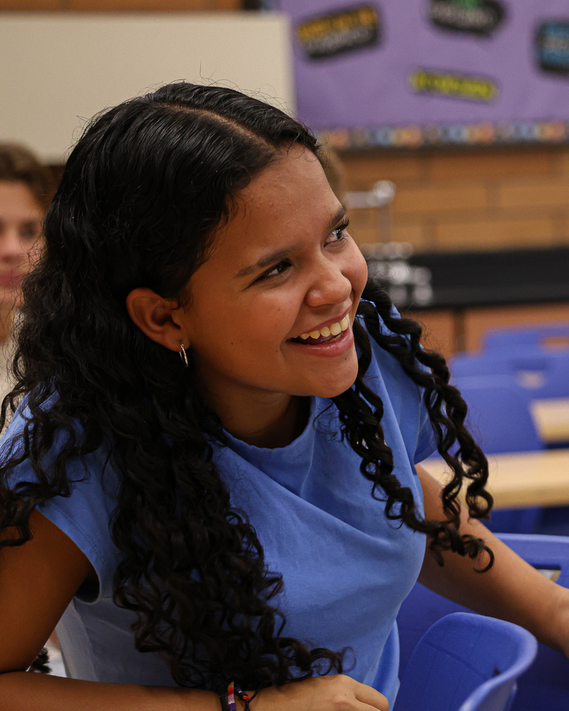 A student smiles while in class.