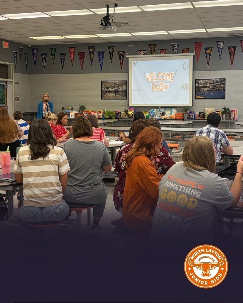 Teachers gather in the cafeteria for the first day back meeting