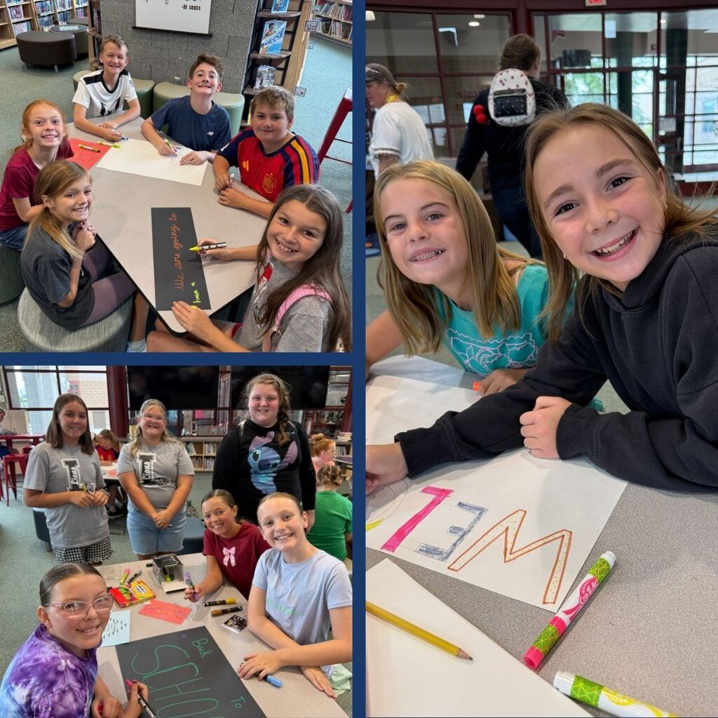 Students creating posters for back to school night.