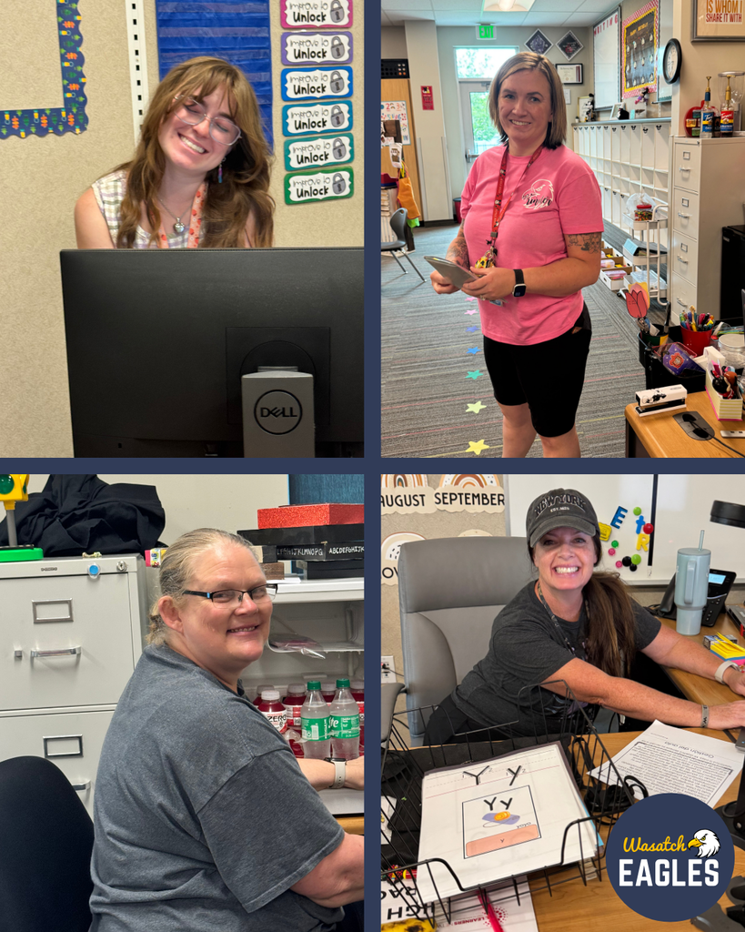Four-photo collage showing staff members preparing for the new school year in classroom and office settings. In the top left, a staff member works at a desk behind a computer monitor in a classroom. Colorful classroom visuals and progress charts labeled "Improve to Unlock" are displayed on the wall behind the desk. In the top right, a staff member stands in a classroom hallway area holding a tablet, with cubbies, classroom supplies, and student organization spaces visible in the background. In the bottom left, a staff member sits at a workspace organizing supplies near filing cabinets, storage shelves, and beverages. In the bottom right, a staff member works at a desk with student learning materials, letter cards, and paperwork organized in trays. A bulletin board displaying the months "August" and "September" is visible behind the desk. The Wasatch Eagles logo appears in the lower-right corner. The collage highlights staff members preparing classrooms, materials, and learning spaces for students' return.