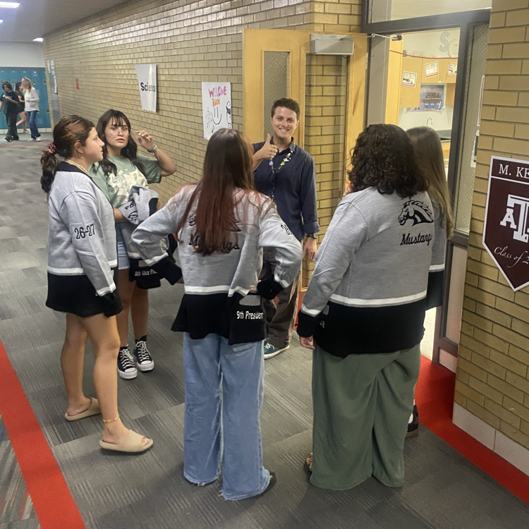 Student government and advisor talking
