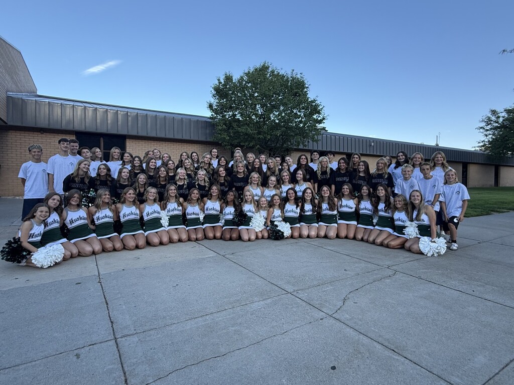 Officers, cheerleaders, and dance company students who greeted students for the new school year on the first day of school. 