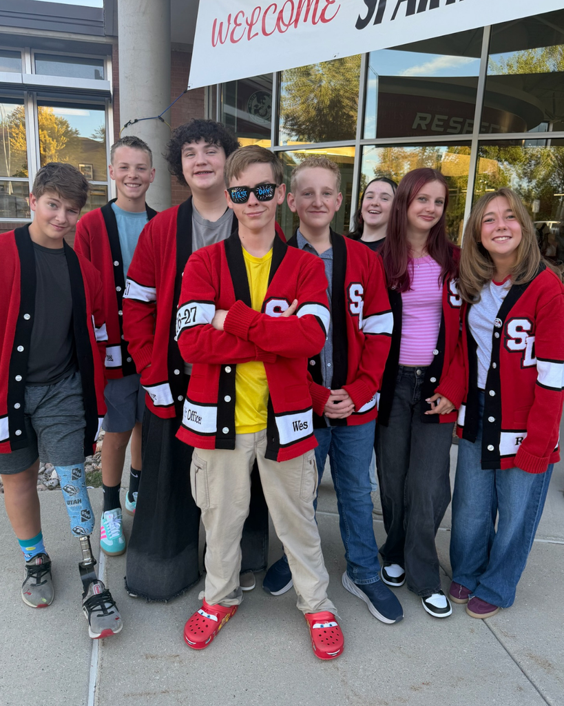 Students smiling with one student wearing glasses that read DSD First Day 2026. 