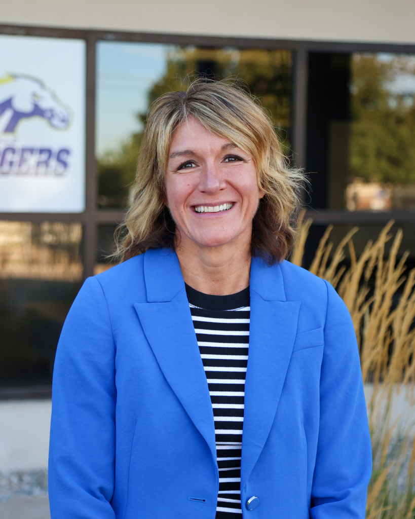 A principal smiling. 
