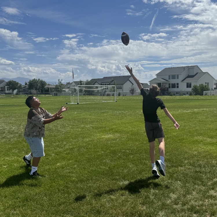 students playing football