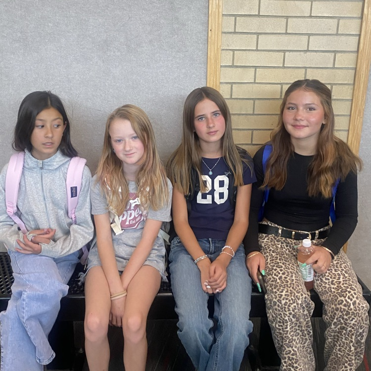 Students sitting in the hallway