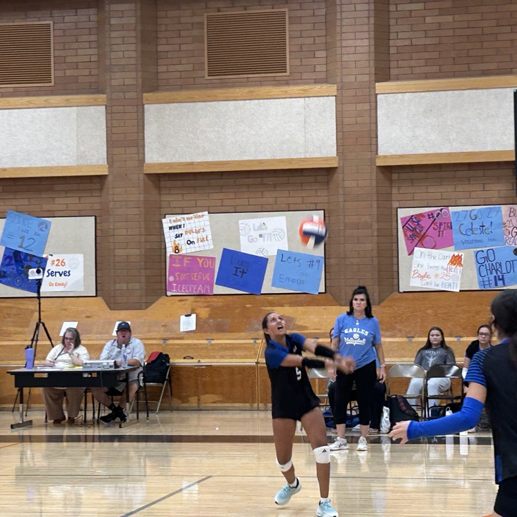 volleyball player bumps the ball