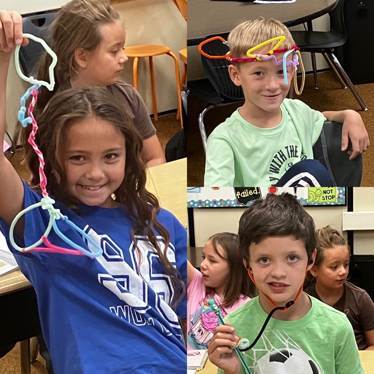 3rd graders showing their sculpture creations from STEM class