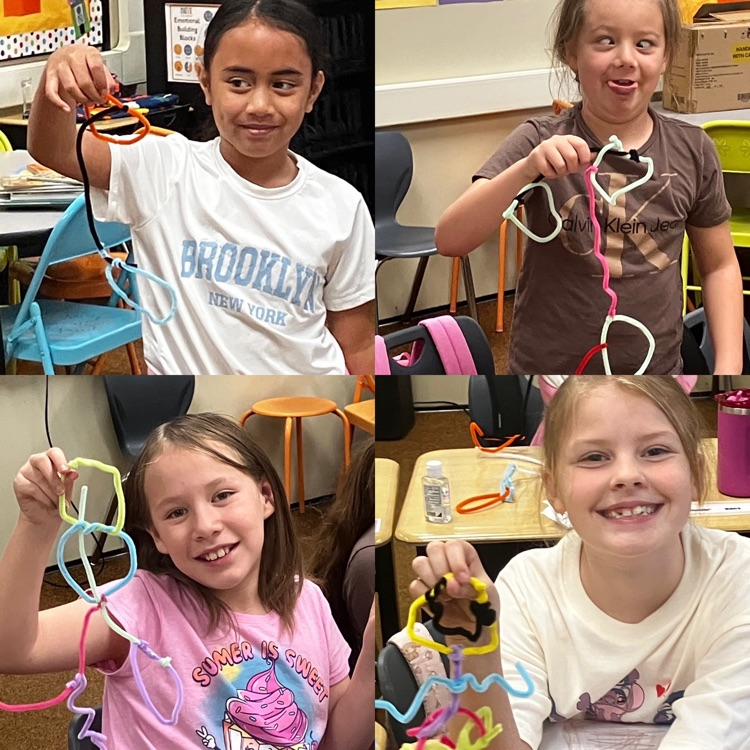 3rd graders showing their sculpture creations from STEM class