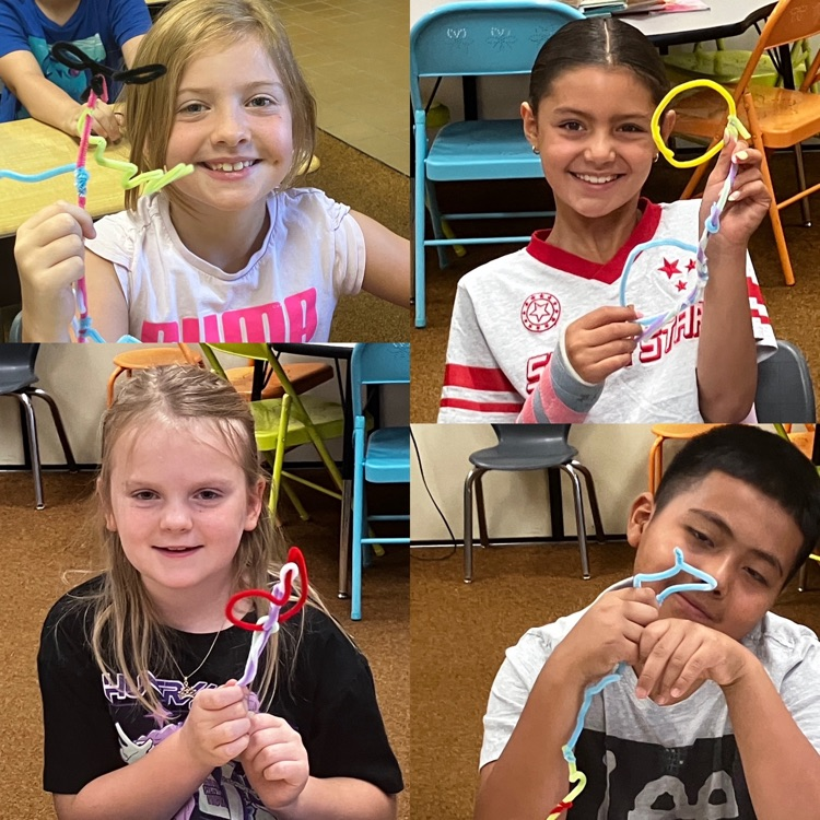 3rd graders showing their sculpture creations from STEM class