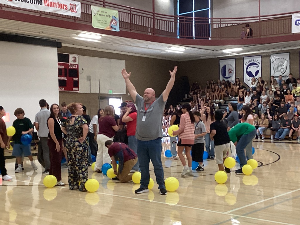 Picture of teachers playing games at back to school assembly