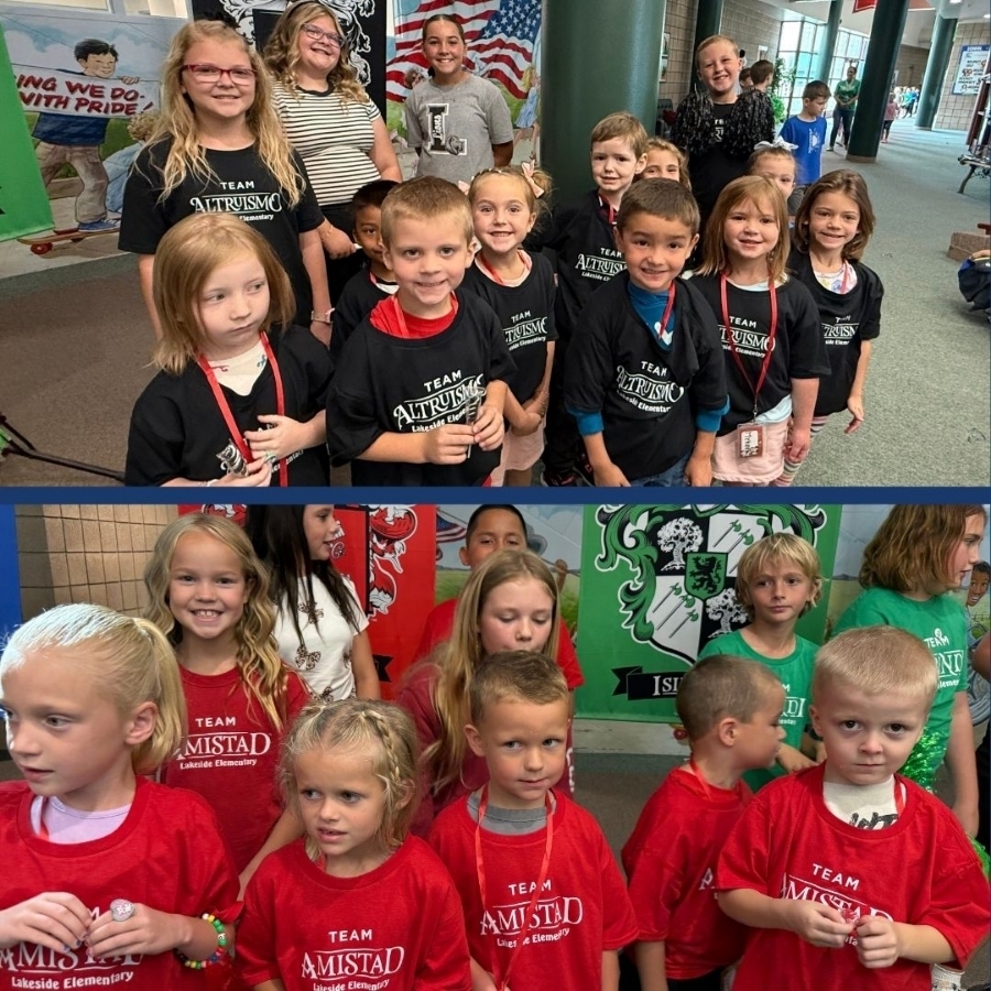 Students pose for a picture wearing their new house shirts.