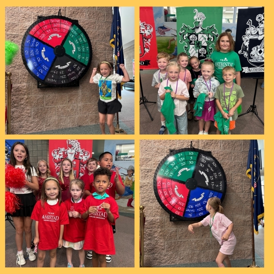 Students pose for a picture in front of their house flag wearing their new house shirt.