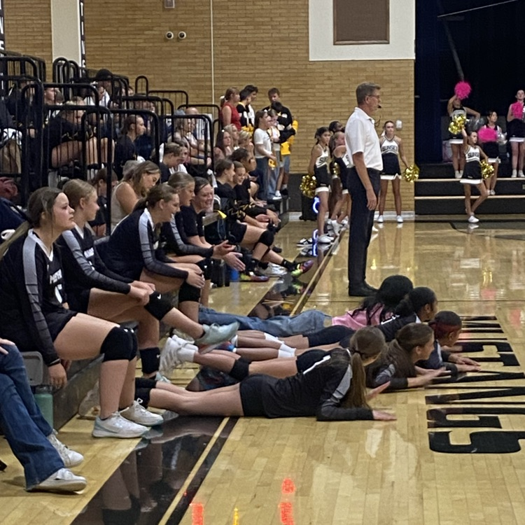 Girls cheering the team from the side