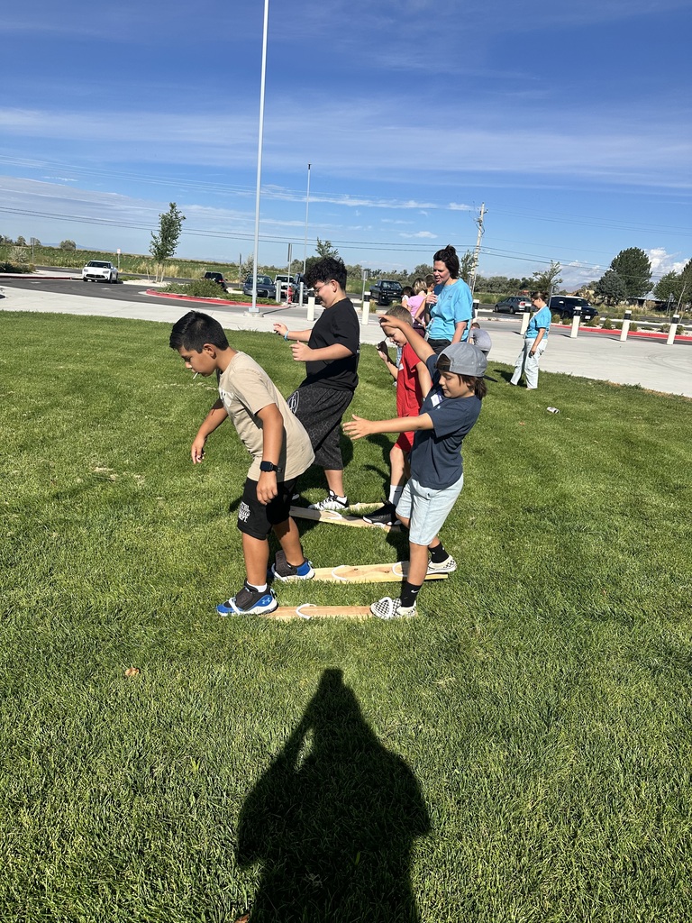 boys standing on wood planks moving forward