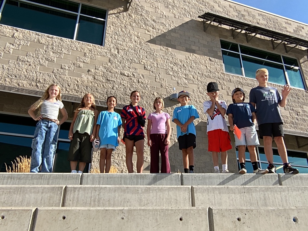 students standing on steps