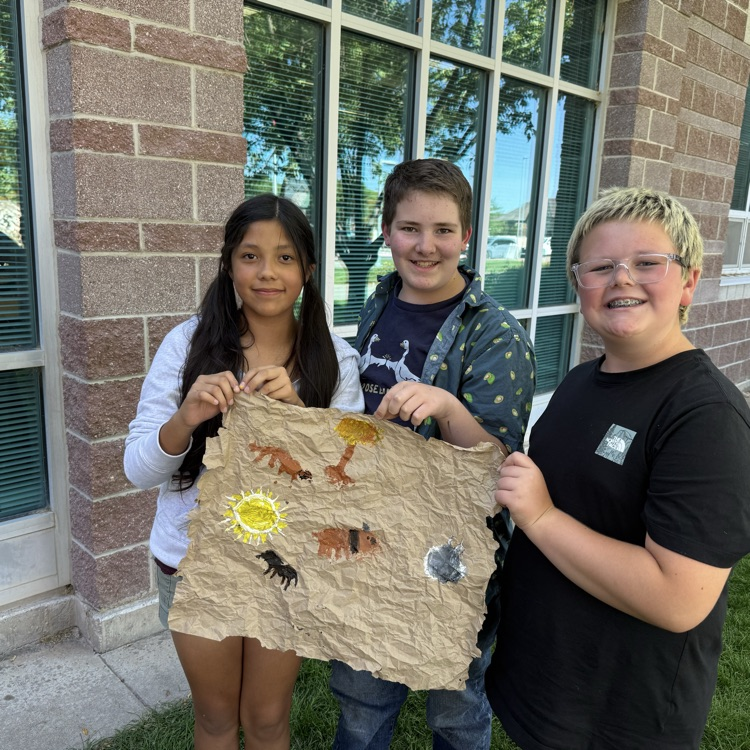 student with cave paintings