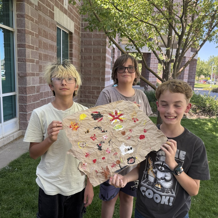 student with cave paintings