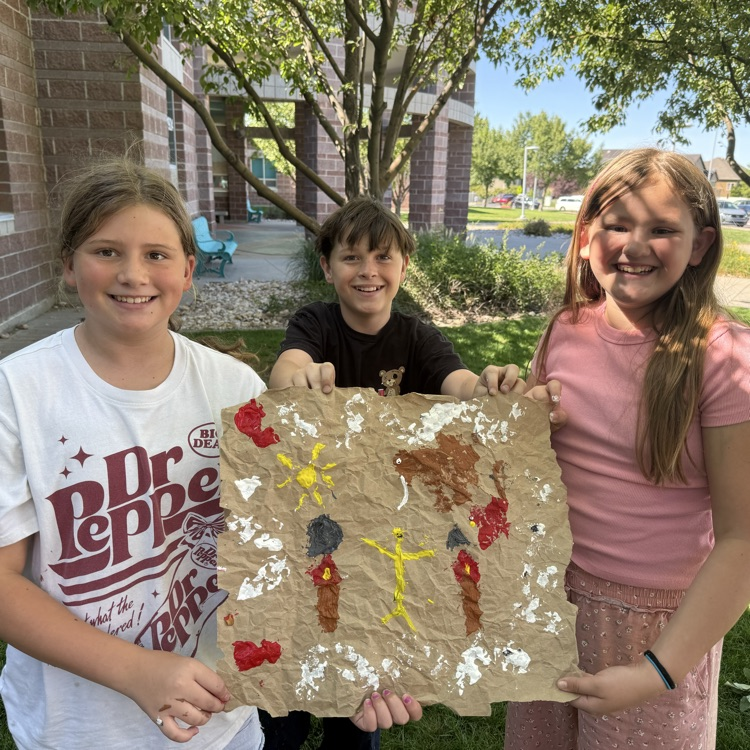student with cave paintings
