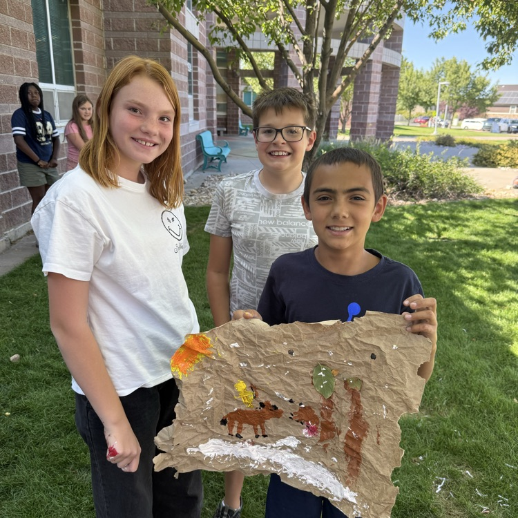student with cave paintings