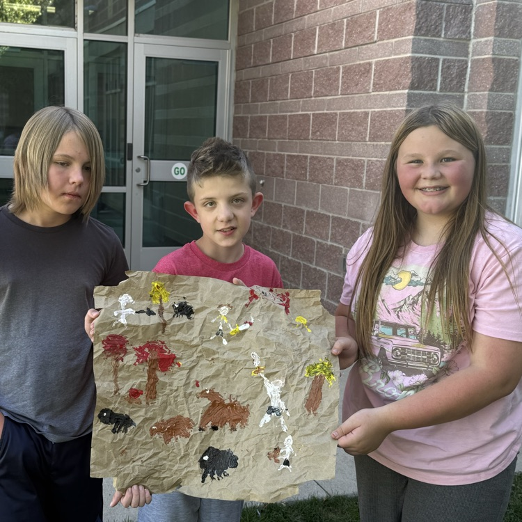student with cave paintings