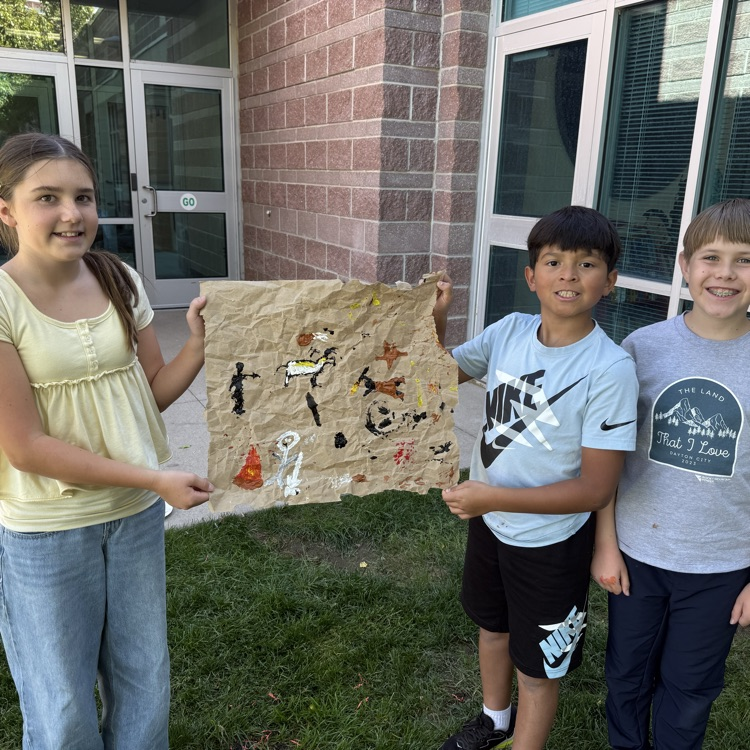 student with cave paintings