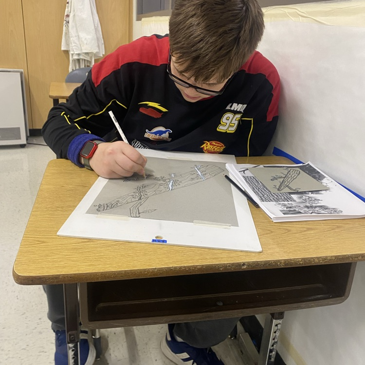 student creating art