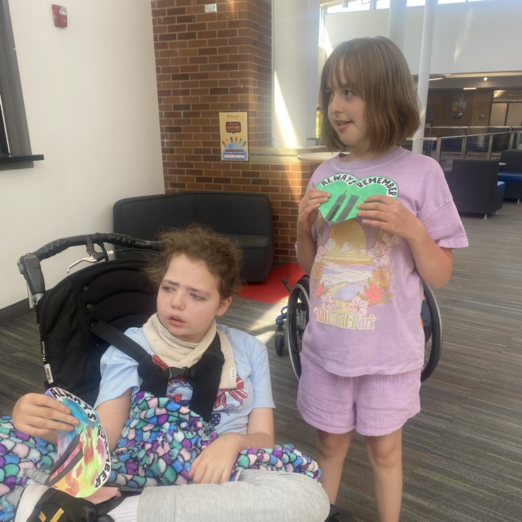 girls holding art