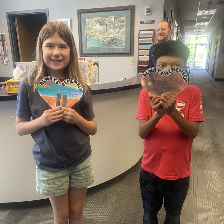 students holding art