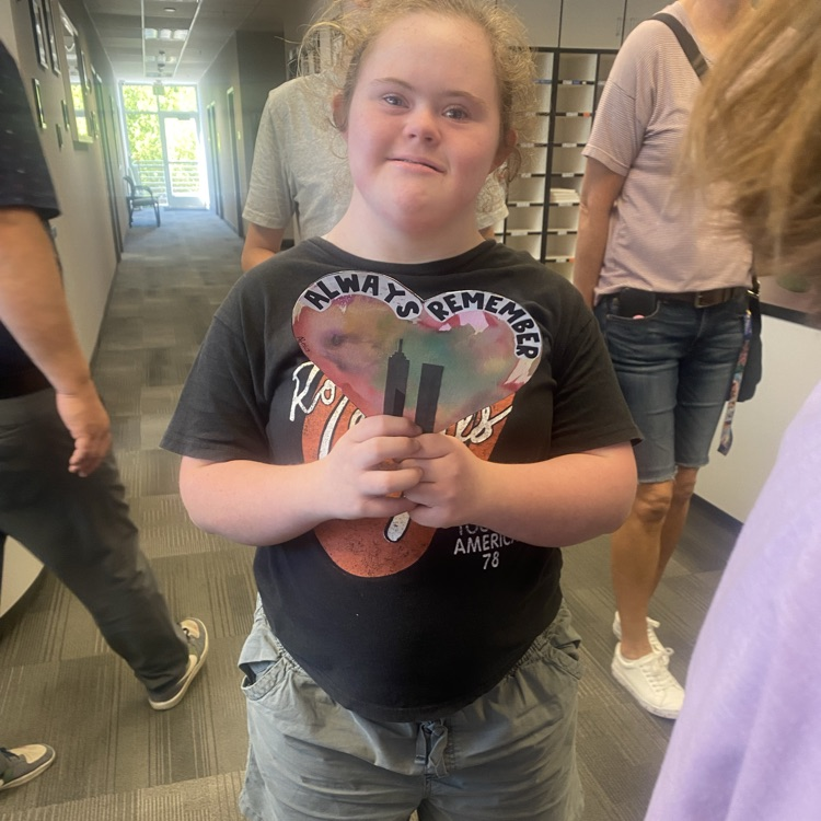 girl holding always remember 9/11 art