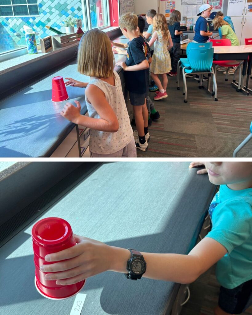 Students participate in a multiplication scavenger hunt around their classroom, matching expressions to pictures and word problems.