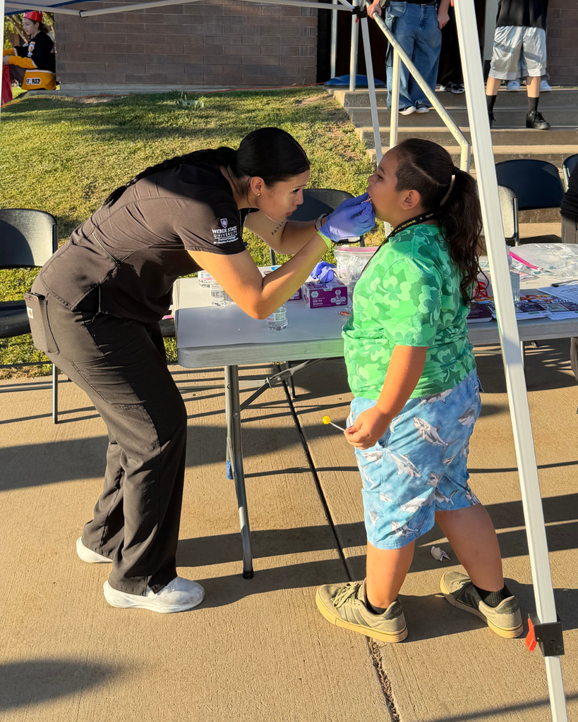 A student having their teeth checked.