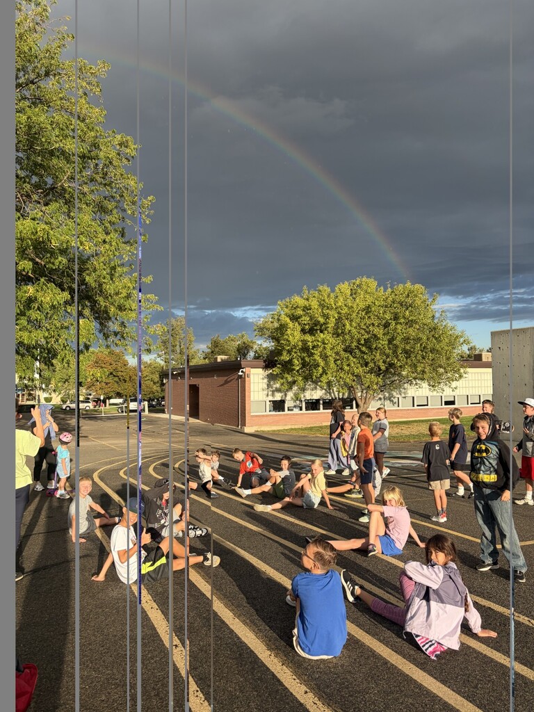 students stretching after running club enjoying the rainbow
