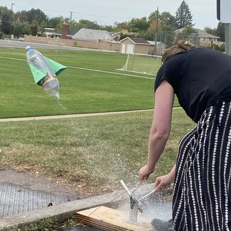 teacher launching rocket