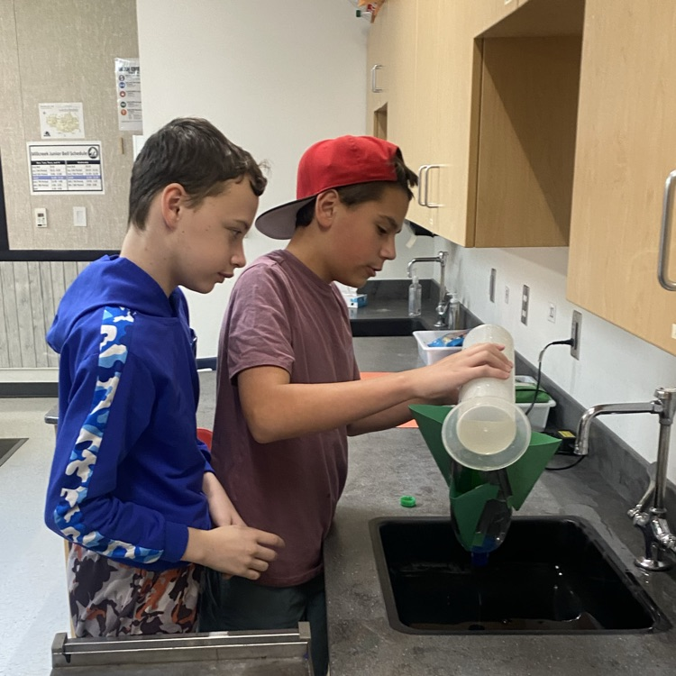 students preparing their rocket for launching